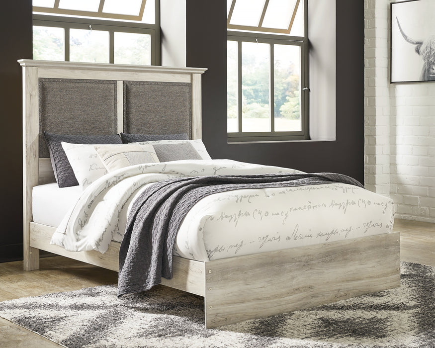 Cambeck King Upholstered Panel Bed with Mirrored Dresser and Chest